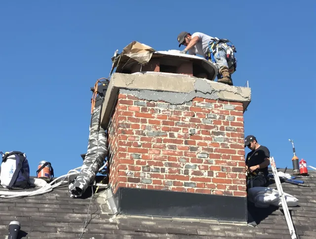 Heath Chimney Sweep installing a custom chimney crown in Heath, OH